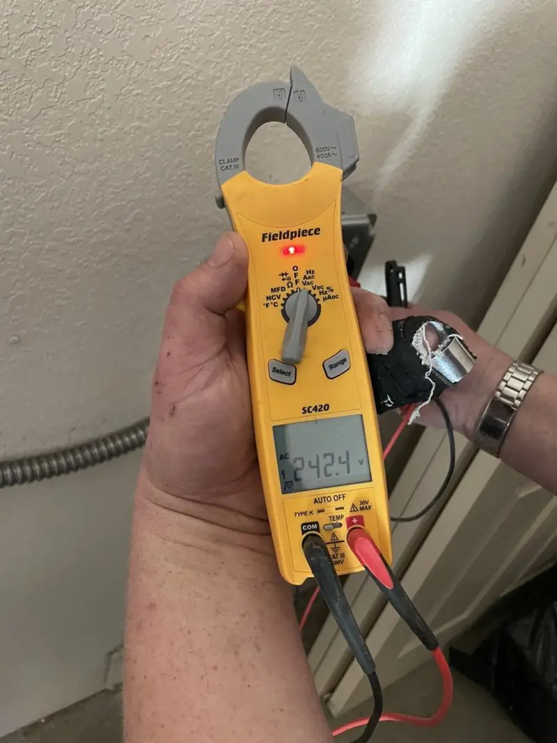 Voltage testing with clamp meter during Electrical Installation Services in Fredericktown